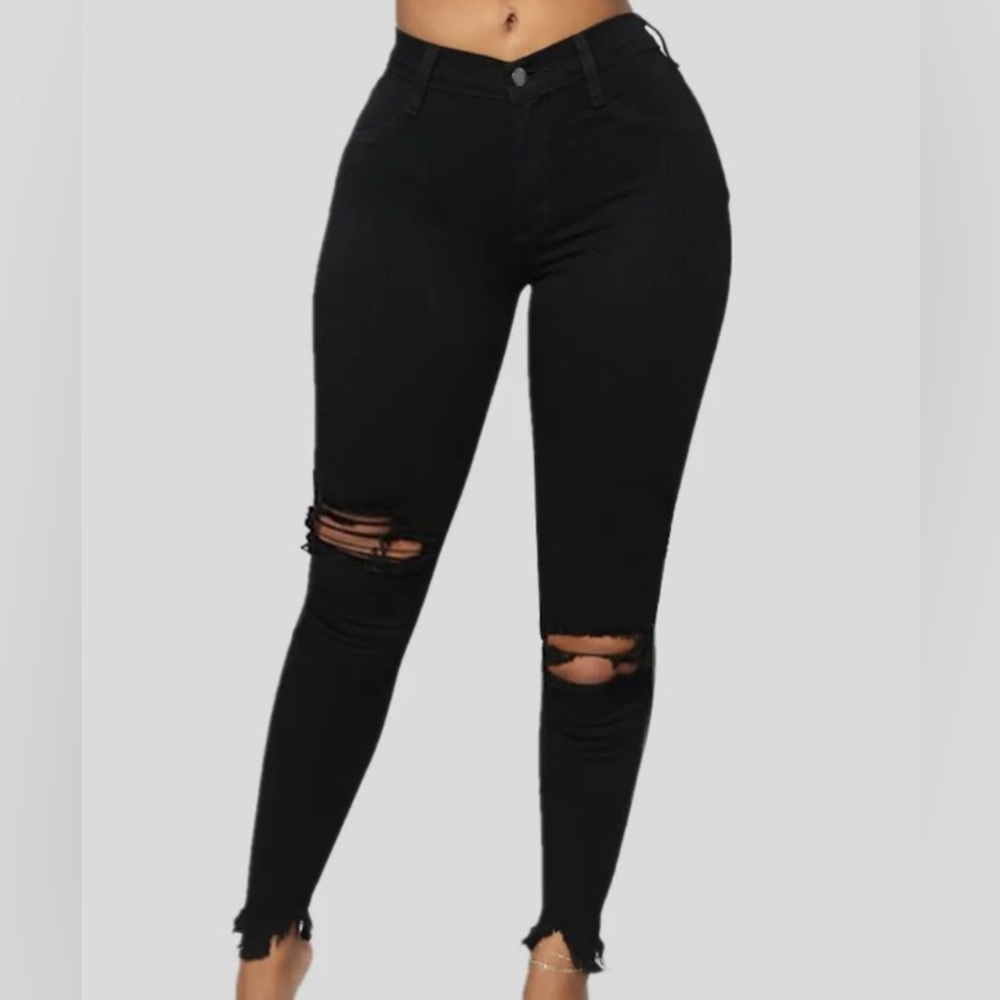 Black high waist skinny jeans with rips and ripped cut off ankle